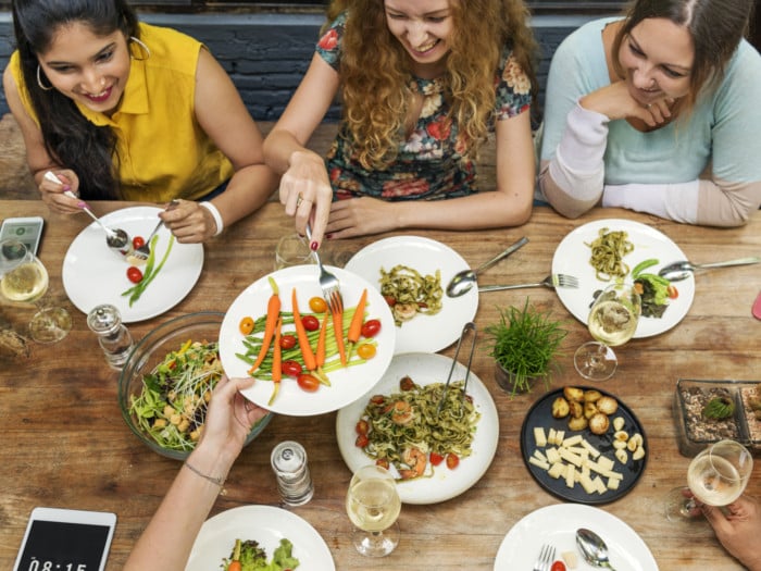 People sitting around a table sharing food