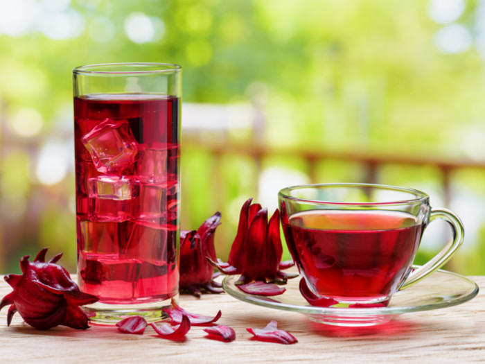 Hot and cold hibiscus tea on a table