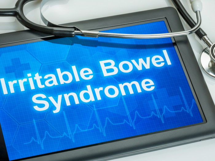 Irritable bowel syndrome flashing on a tablet with a stethoscope