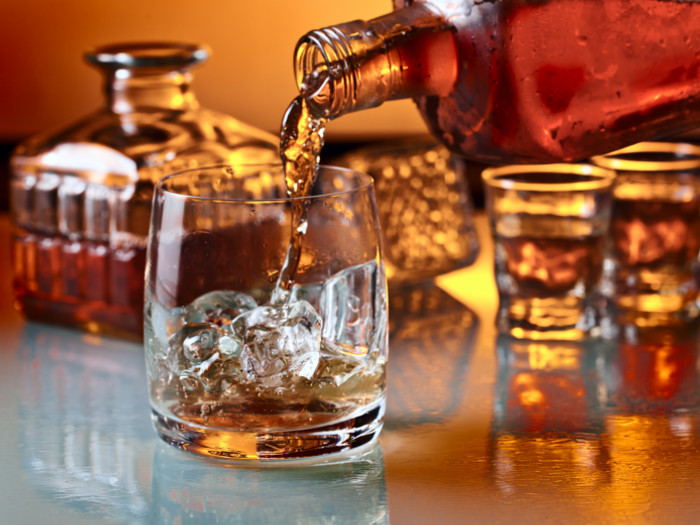 Whiskey being poured into a glass