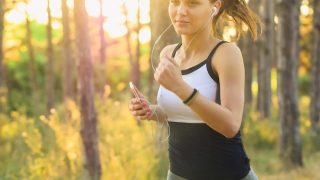 A woman jogging while listening to music