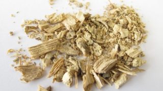 Close up of dried kava root on a white background