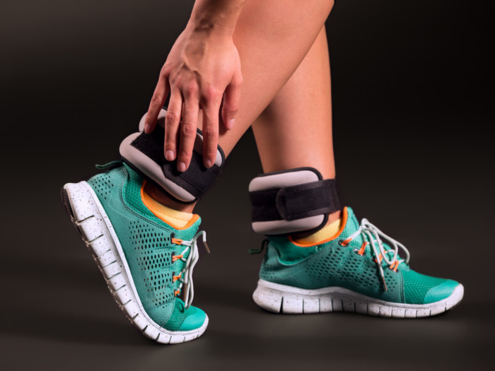 A pair of feet wearing leg weights