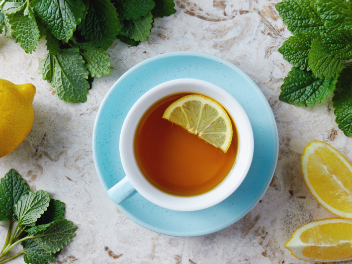 Top-view of a cup of lemon balm tea