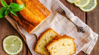 Lemon pound cake on rustic wooden background with lemon
