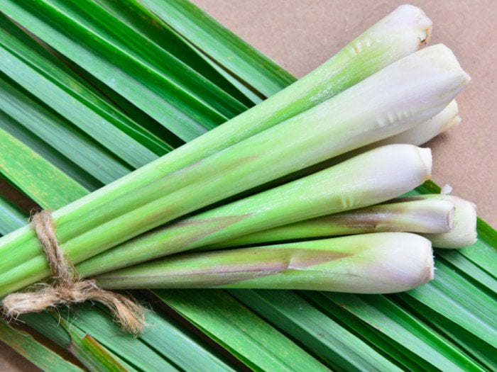 Lemongrass leaves on a wooden table