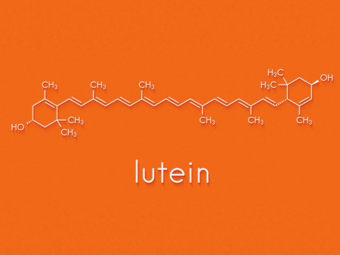 A photo of lutein with its skeletal formula