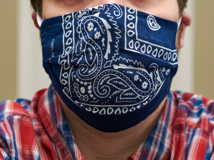 Woman in a homemade bandana face mask.