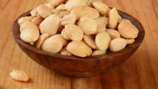 A close-up shot of a bowl of Marcona almonds