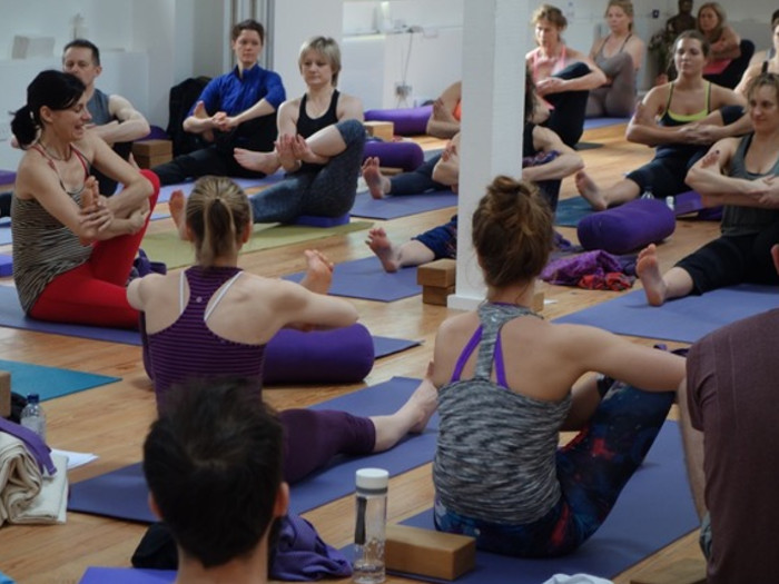 A group of women doing yoga