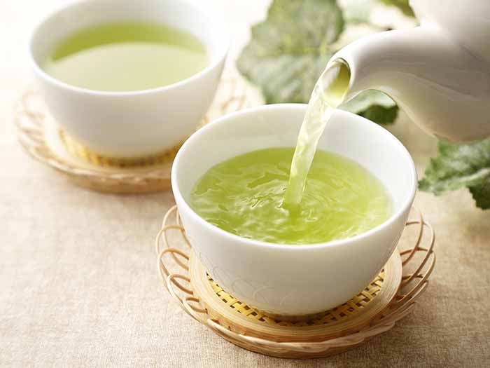 Tea being poured into a cup