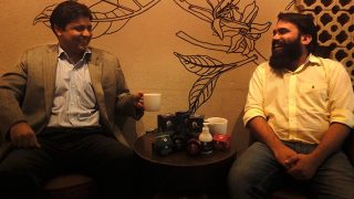 Vikas Lachhwani and Tarun Sharma, founders of MCaffeine, smiling at each other