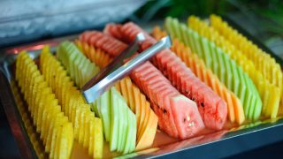 Variety of sliced melons on a fruit tray