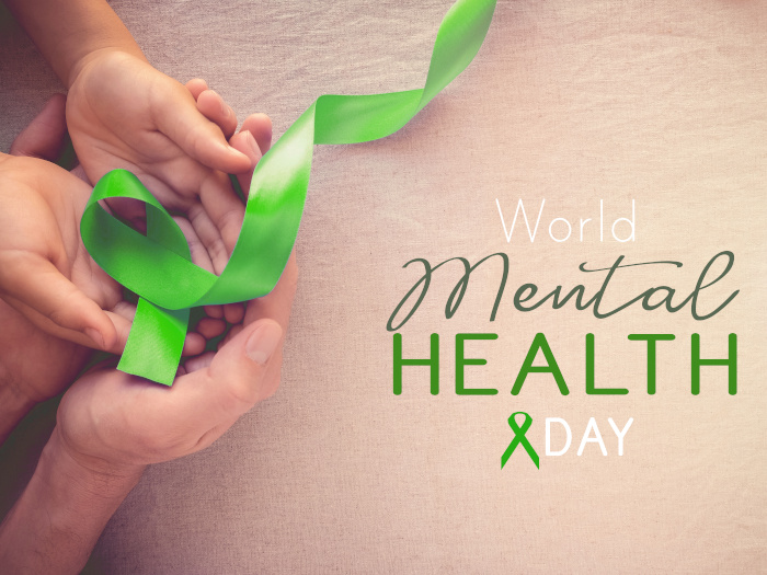 Adult and child holding lime green ribbon for mental health awareness