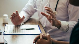Doctor explaining the treatment to a patient in detail