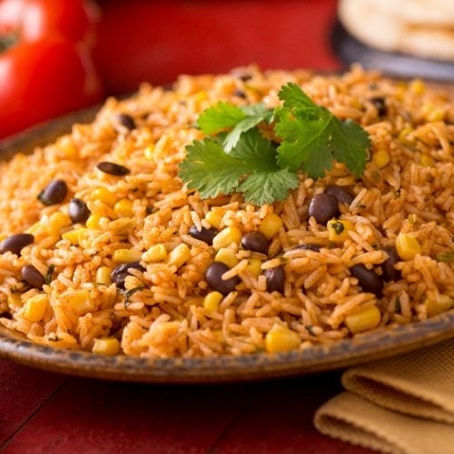 A plate of delicious authentic Mexican Rice with black beans, corn, garlic, and cilantro