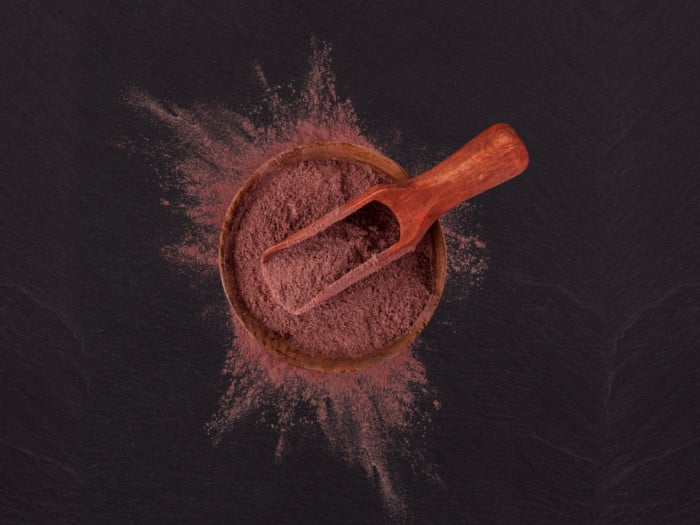Mimosa hostilis root bark powder in a spoon