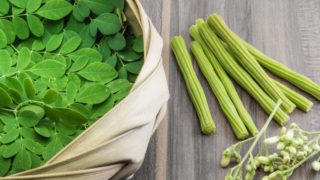 Fresh moringa leaves, moringa fruit or drumsticks, and moringa seeds