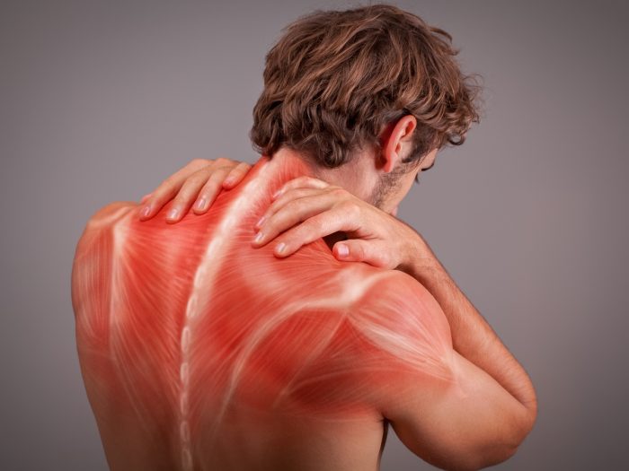 A person suffering from a sore back