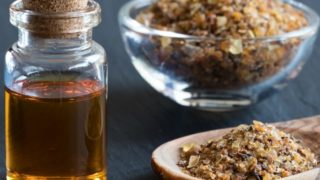 A bottle of myrrh essential oil with myrrh resin
