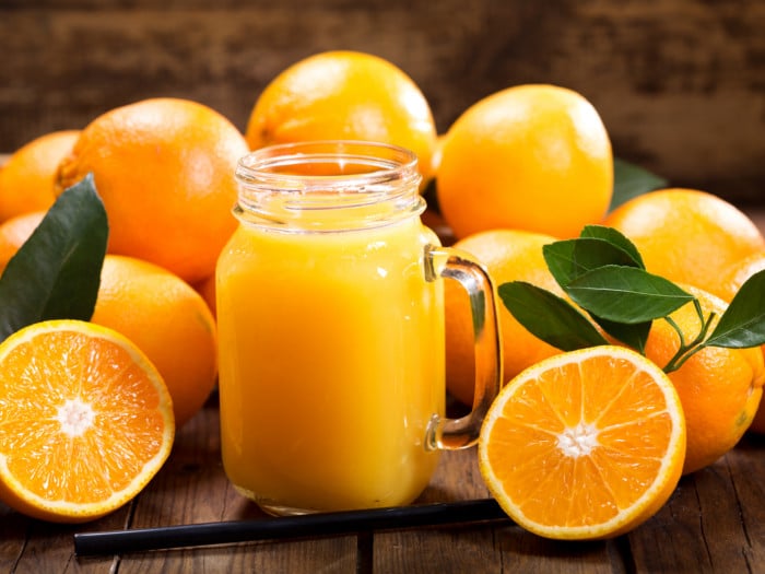 A jar filled with fresh orange juice