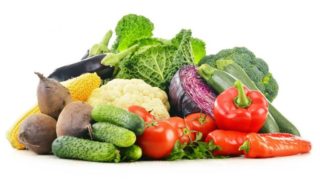 Vegetables piled on top of each other on a white background.