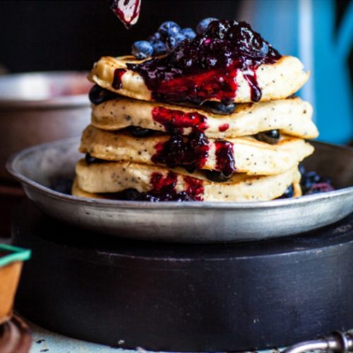 Vegan protein pancake covered in maple syrup and mixed berries