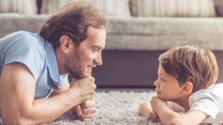 A close-up picture of father and son bonding