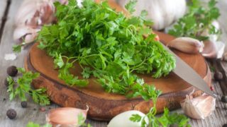 Chervil leaves on a wooden board
