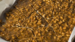 peanut butter brittle on a baking sheet