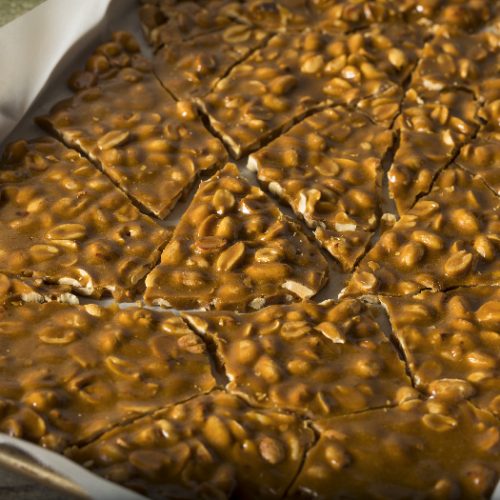 peanut butter brittle on a baking sheet