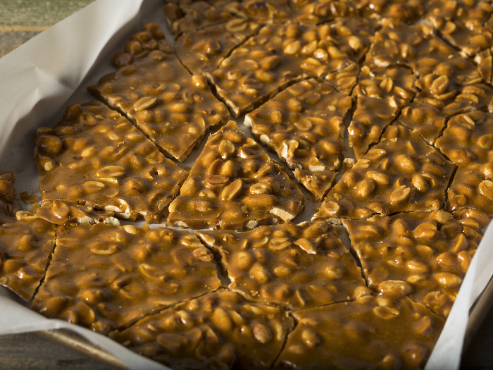 peanut butter brittle on a baking sheet