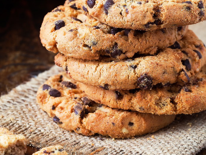 Peanut butter chocolate chip cookies stacked on one another