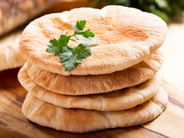 Pita bread on a wooden board