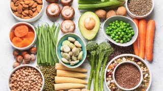 Food sources of plant based protein. Healthy diet with legumes, dried fruit, seeds, nuts and vegetables. Foods high in protein, antioxidants, vitamins and fiber.