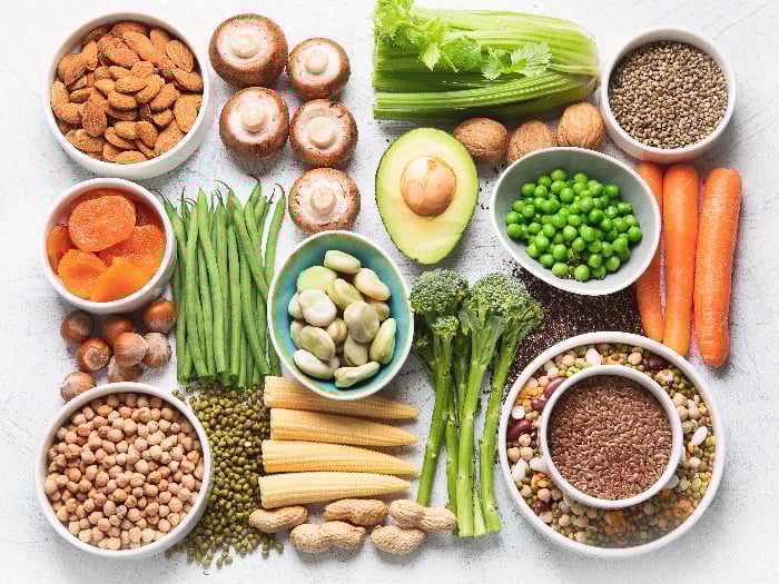 Healthy diet concept with legumes, dried fruit, seeds, nuts and vegetables