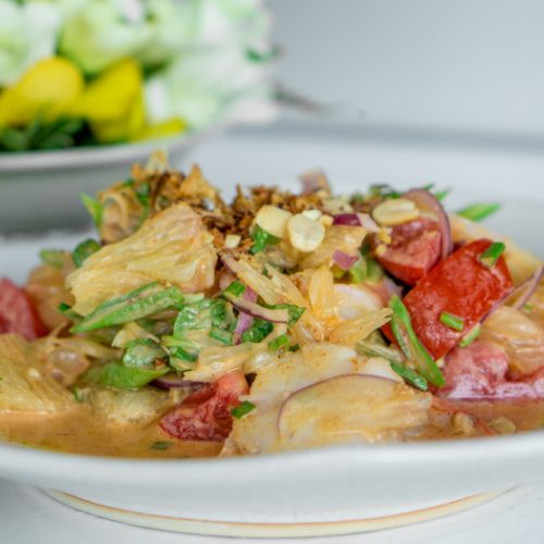 A close up shot of pomelo salad or "Yum Som O", traditional Thai food