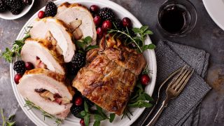 Roasted pork loin stuffed with apple and cranberry with spices