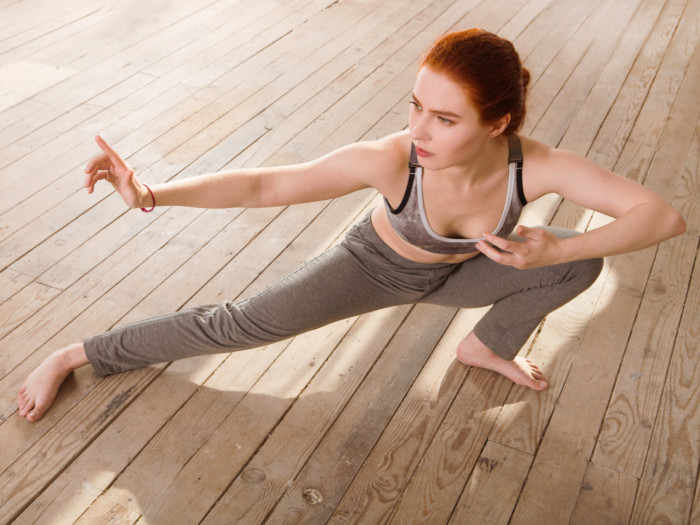 Woman doing a qigong pose outdoors