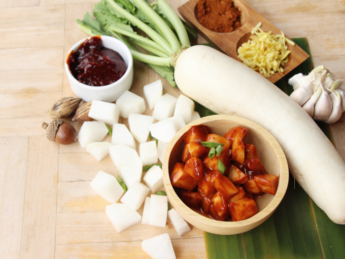 Kimchi, a traditionally Korean side dish kept atop a table along with radish and other ingredients