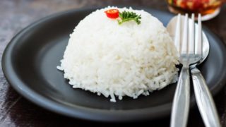 A pyramid of rice on a plate in a restaurant