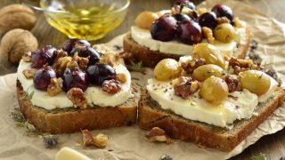 Crostini with roasted grapes, goat cheese, walnuts, and honey