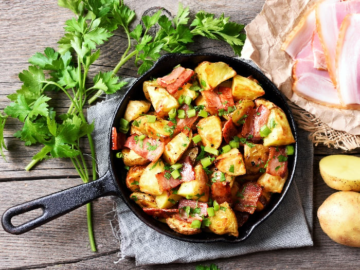 A flatlay picture of roasted potato in frying pan