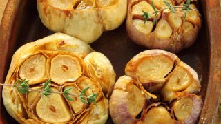 Fresh roasted garlic with olive oil and spices.