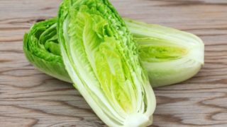 Romaine lettuce on a wooden background