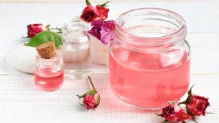 Large bottle of rose water with two smaller bottles