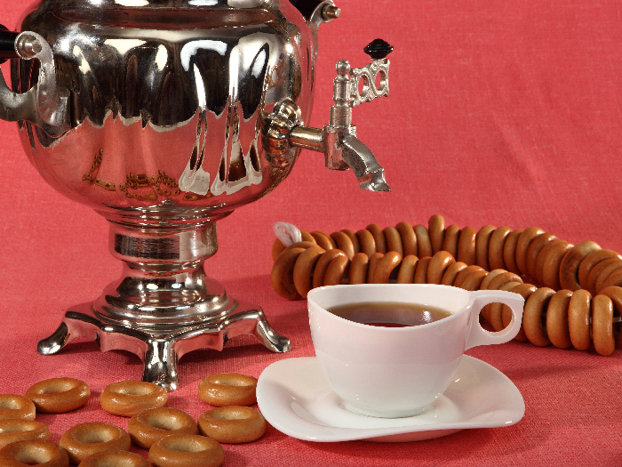 Russian samovar with bagels and cups of tea