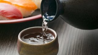 Pouring sake into a cup