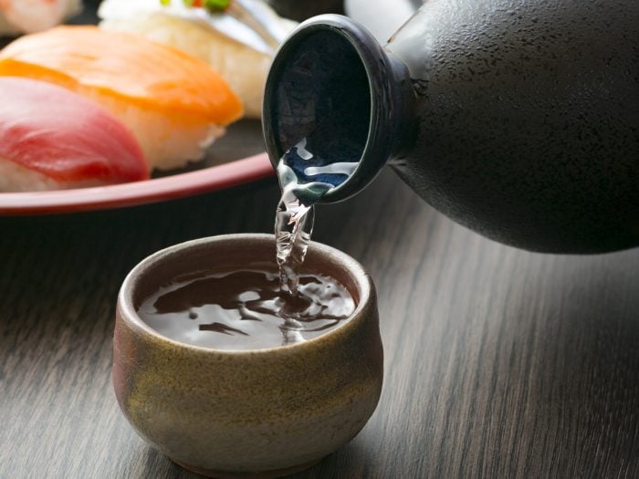 Pouring sake into a cup