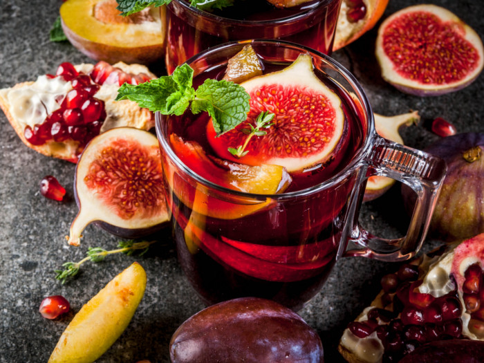 Sangria with figs, peaches, pomegranate, plums, and mint